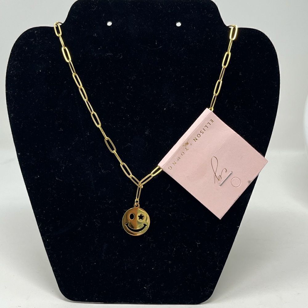 NWT, Ellison + Young paper clip happy face, gold tone necklace.